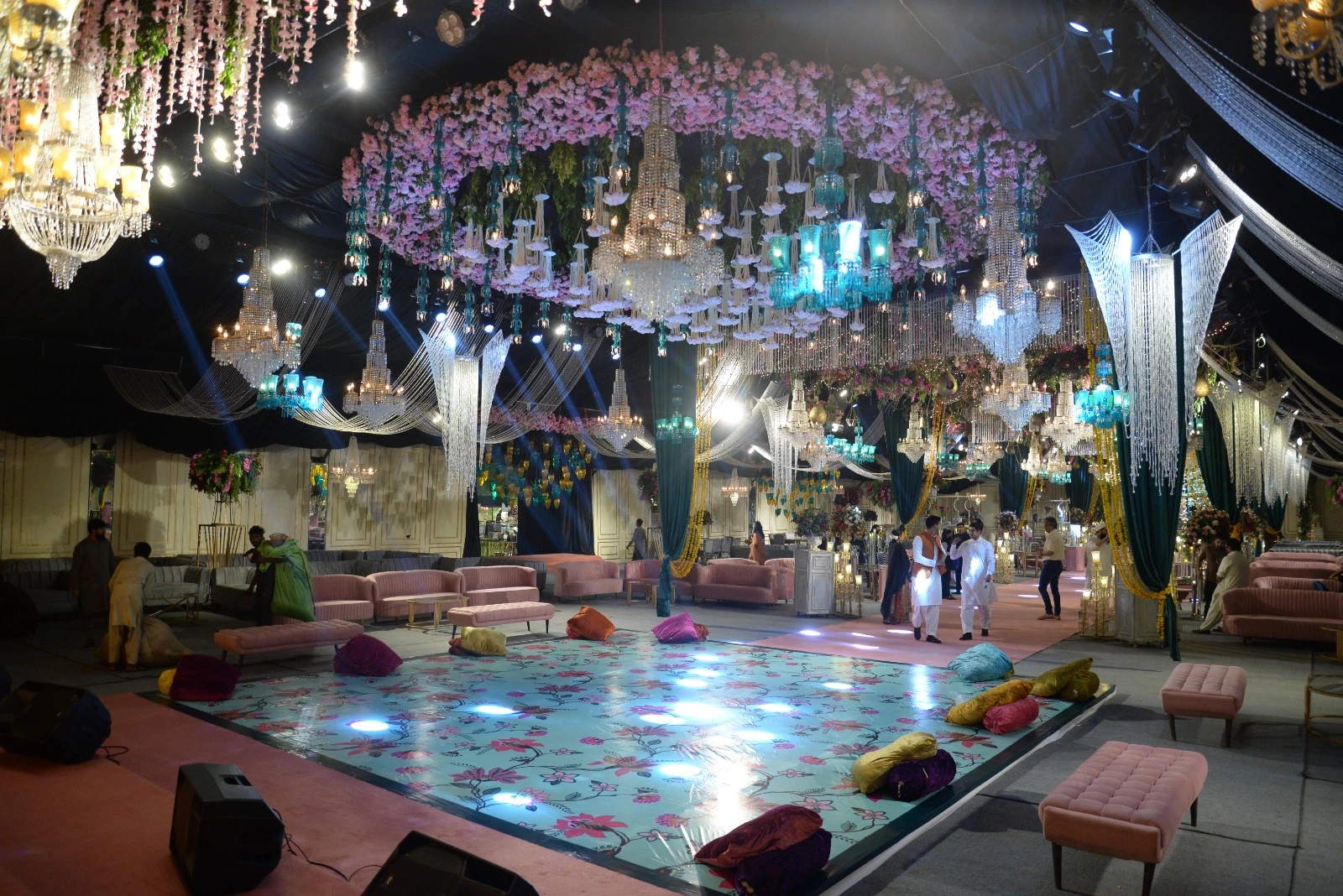 Mehndi decor in Lahore by VenueHub with dance floor seating flowers and chandeliers